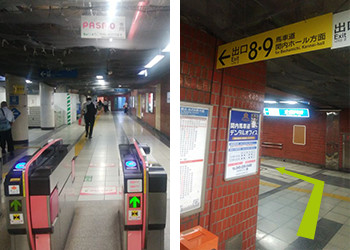 改札を出て左側に見える階段を上り、出口８・９の方向へ向かいます。
